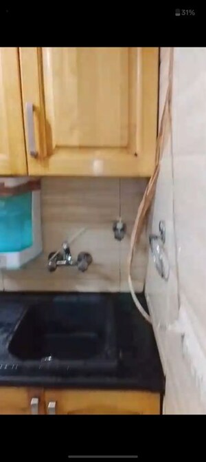 Bathroom in 2 BHK Apartment at Kailash Colony – for Rent