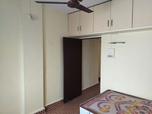 Bedroom in 1 BHK Apartment at Laxmi Tara Market, Thergaon – for Rent