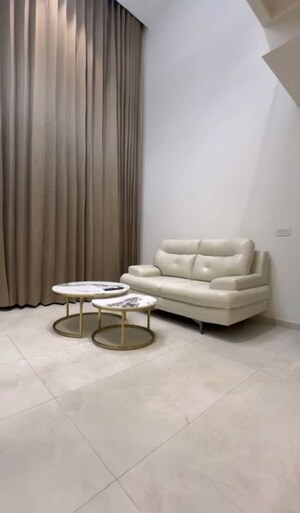 Living Room in Studio Apartment at M3M Corner Walk, Sector 74 – for Rent