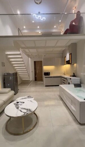 Living Room in Studio Apartment at M3M Corner Walk, Sector 74 – for Rent