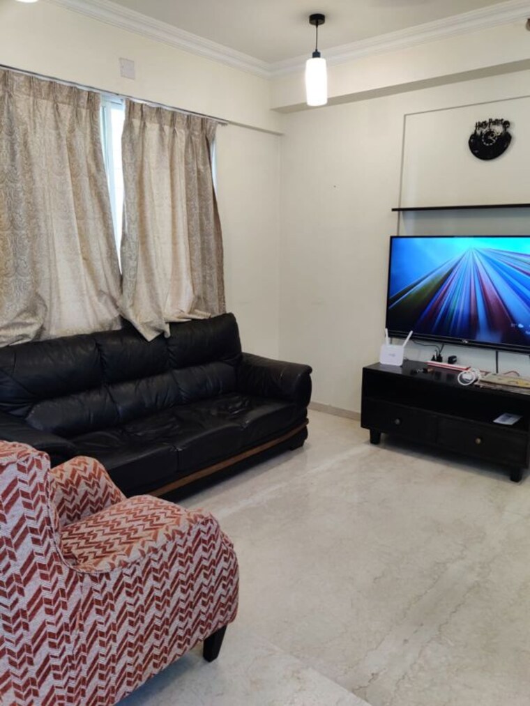 Living Room, gera-song-of-joy  1200 Sq.Ft. Apartment In Kharadi Pune 10497411