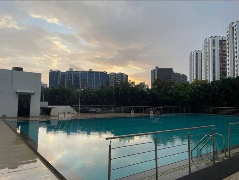 Swimming Pool, gera-song-of-joy  1200 Sq.Ft. Apartment In Kharadi Pune 10497411