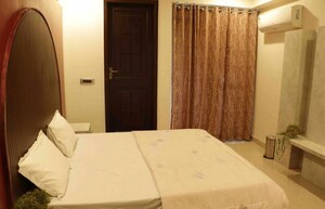 Bedroom in 4 BHK Builder Floor at Bhagirathi Puram – for Rent