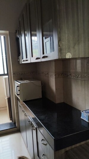 Kitchen in 1 BHK Apartment at K Raheja Heights, Malad East – for Rent