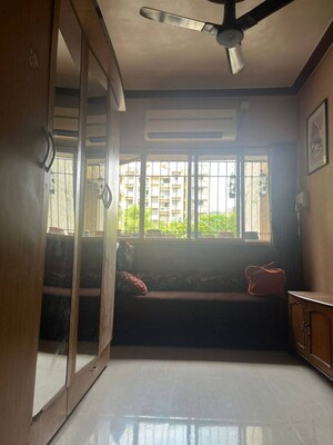 Bedroom in 2 BHK Apartment at Pearl CHS, Dadar East – for Rent