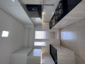 Kitchen in  Apartment at Bhartiya Nikoo Homes Phase 2, Thanisandra Main Road – for Rent