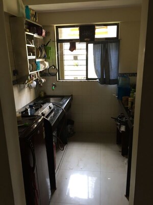 Kitchen in 2 BHK Apartment at Divya Smruthi, Malad West – for Rent