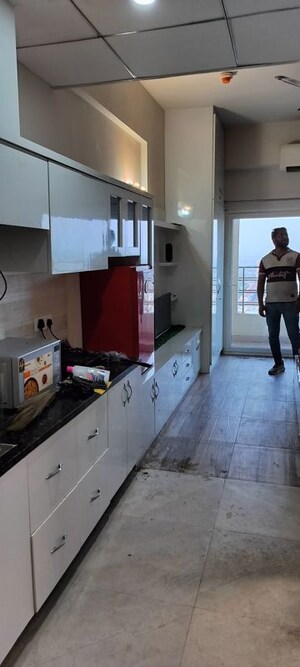 Kitchen in 1 RK Apartment at Paramount Golf Forest Studio Apartments - OAK Towe, Zeta I Greater Noida – for Rent