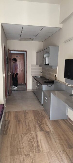 Kitchen in 1 RK Apartment at Paramount Golf Forest Studio Apartments - OAK Towe, Zeta I Greater Noida – for Rent