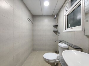 Bathroom in 2 BHK Apartment at Bhartiya Nikoo Homes Phase 2, Thanisandra Main Road – for Rent