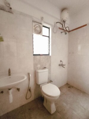Bathroom in 2 BHK Apartment at Kolte Patil Margosa Heights, Mohammadwadi – for Rent