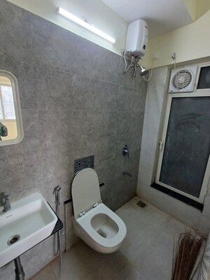 Bathroom in 2 BHK Apartment at Omkar Signet, Malad East – for Rent