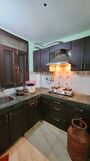 Kitchen in 2 BHK Builder Floor at Freedom Fighters Enclave – for Rent