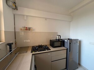 Kitchen in 1 BHK Apartment at Hiranandani Estate Solitaire C, Ghodbunder Road – for Rent