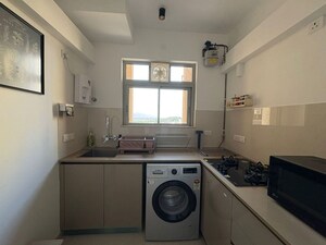 Kitchen in 1 BHK Apartment at Hiranandani Estate Solitaire C, Ghodbunder Road – for Rent