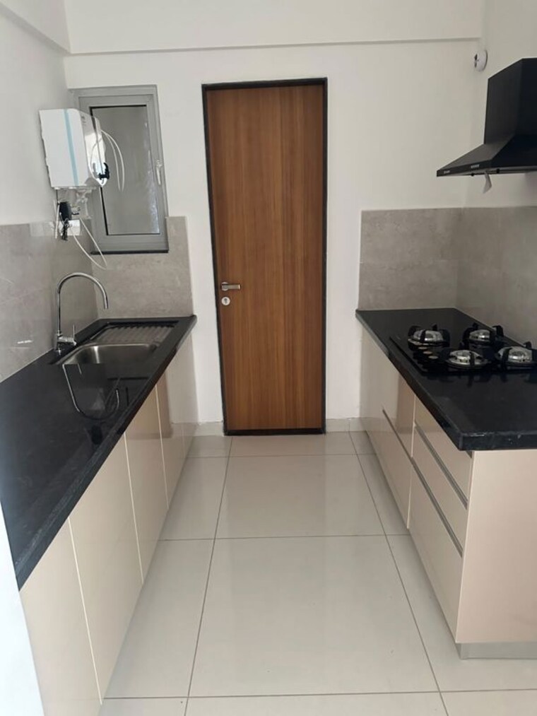 Kitchen, gera-planet-of-joy 2 Bedroom 724 Sq.Ft. Apartment In Kharadi Pune 10512146