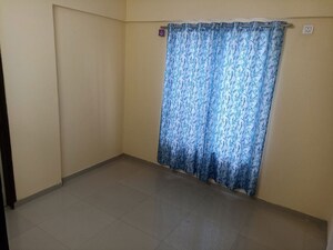 Bedroom in 2 BHK Apartment at TK Narmada Blue Sapphire, Tathawade – for Rent