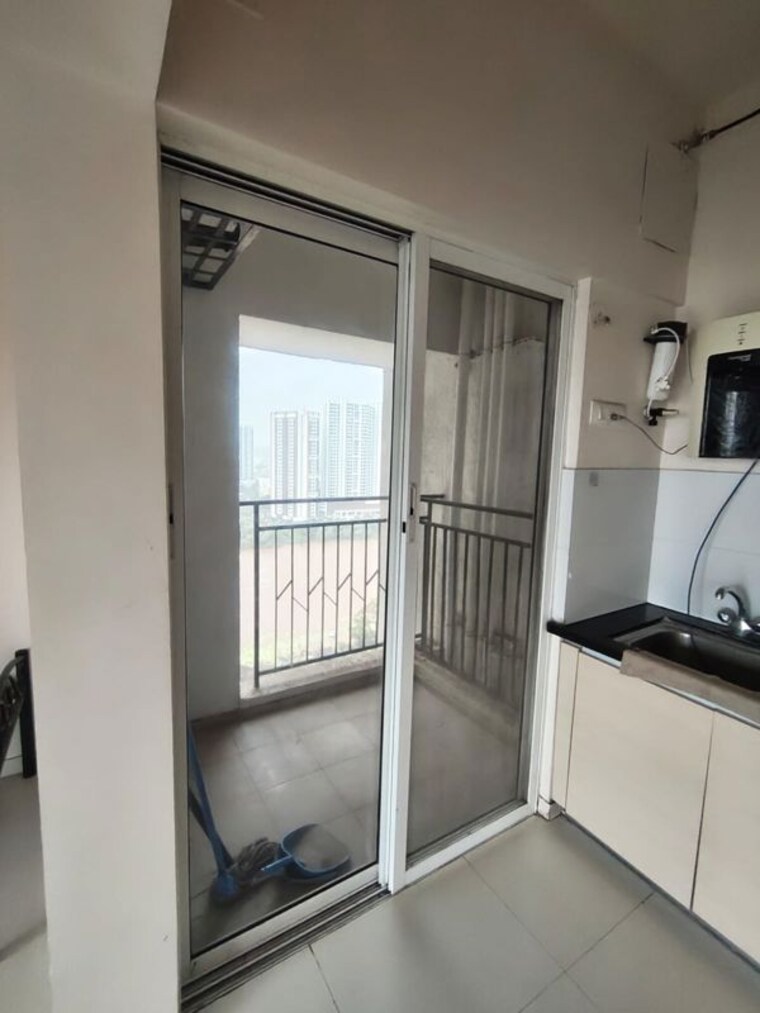 Kitchen, gera-world-of-joy 2 Bedroom 1000 Sq.Ft. Apartment In Kharadi Pune 10512806