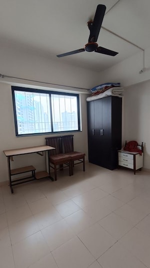 Living Room in 1 BHK Apartment at Kohinoor Riverdale, Kharadi – for Rent