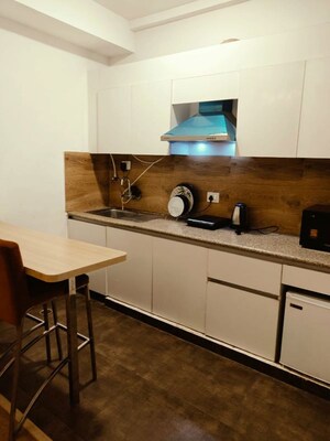 Kitchen in 1 BHK Apartment at Nimbus The Golden Palm, Sector 168 – for Rent