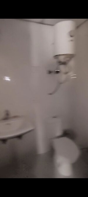 Bathroom in 2 BHK Apartment at Charms Castle, Raj Nagar Extension – for Sale