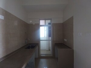 Kitchen in 3 BHK Apartment at Dosti West County, Balkum Pada – for Rent