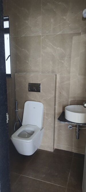 Bathroom in 1 BHK Apartment at Dhamji Shamji Mahavir Spring Tulip Phase 1, Pokhran Road No Two – for Rent