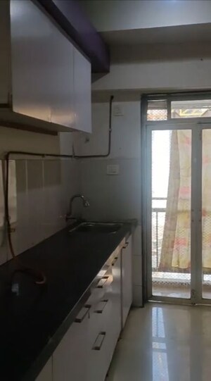 Kitchen in 3 BHK Apartment at Conwood Enclave, Vasant Vihar – for Rent