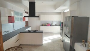 Kitchen in 4 BHK Apartment at Mahagun Mezzaria, Sector 78 – for Rent