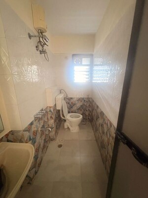 Bathroom in 2.5 BHK Apartment at Kanakia Spaces Niharika, Manpada – for Rent