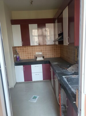 Kitchen in 3 BHK Apartment at Mahagun My Woods, Sector 16c Greater Noida – for Rent