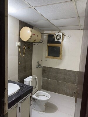 Bathroom in 3 BHK Apartment at Mahagun Moderne, Sector 78 – for Rent