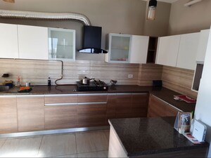 Kitchen in 3 BHK Apartment at ABA Cleo County, Sector 121 – for Rent