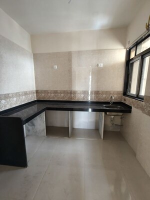 Kitchen in 3 BHK Apartment at EV Shraddha CHS LTD, Vashi Sector 10a – for Sale