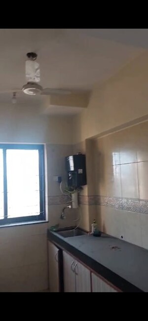 Kitchen in 3 BHK Apartment at K Raheja Palm Spring, Malad West – for Rent