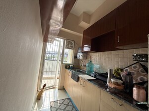 Kitchen in 1 BHK Apartment at Amrapali Dream Valley – for Rent