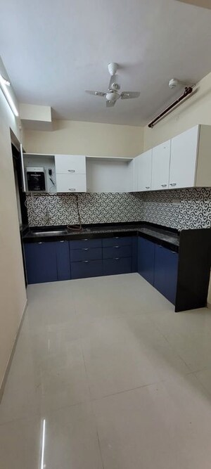 Kitchen in 2 BHK Apartment at Cosmos Infinity, Ghodbunder Road – for Rent