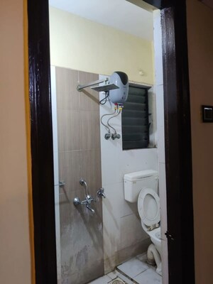 Bathroom in 2 BHK Apartment at Unnati Woods CHS, Kasarvadavali – for Rent