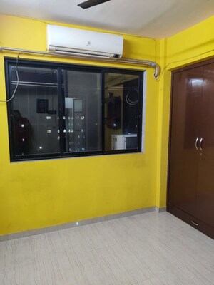 Room in 2 BHK Apartment at Unnati Woods CHS, Kasarvadavali – for Rent