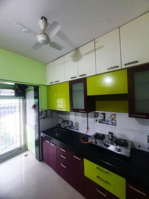 Kitchen in 2 BHK Apartment at Rustomjee Urbania Acura, Thane West – for Rent