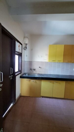 Kitchen in 3 BHK Apartment at Nandakini Alaknanda Estate, Amar Shaheed Path – for Rent