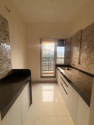 Kitchen in 2 BHK Apartment at Raunak Residency Thane, Pokhran Road No One – for Rent