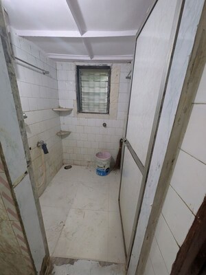 Bathroom in 1 BHK Apartment at Sameepan CHS, Satya Nagar – for Rent