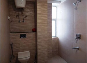Bathroom in 4 BHK Apartment at Suraj Oranje Castle, Gomti Nagar – for Rent