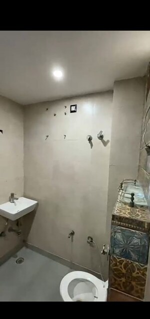 Bathroom in 3 BHK Builder Floor at Dwarka Mor – for Sale