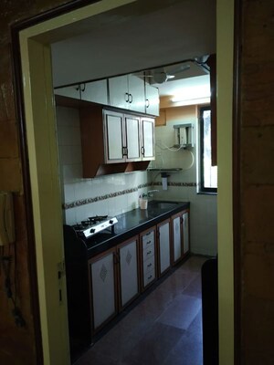 Kitchen in 2 BHK Apartment at Gemstar Nestle Apartments, Malad West – for Rent