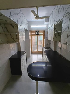 Kitchen in 2 BHK Apartment at Lokhandwala Whispering Palms, Kandivali East – for Rent