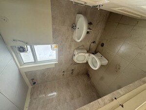 Bathroom in 2 BHK Apartment at Wave Dream Homes, Wave City – for Rent