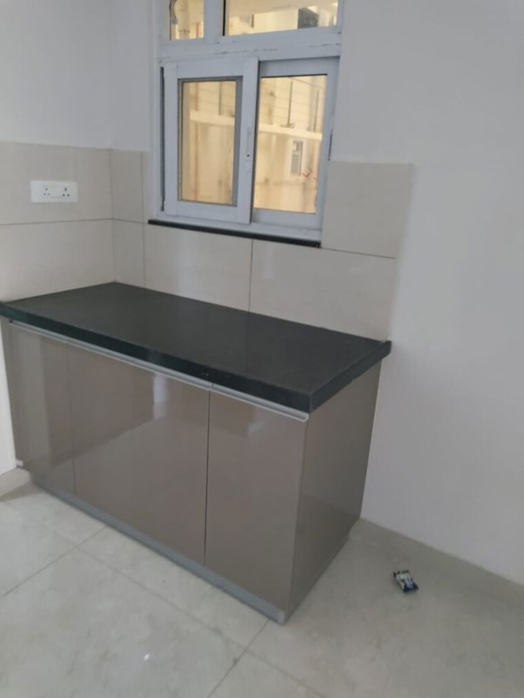Kitchen, gera-world-of-joy 2 Bedroom 810 Sq.Ft. Apartment In Kharadi Pune 10520846
