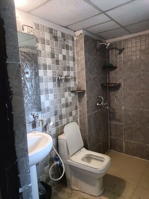 Bathroom in 2 BHK Apartment at Aims Golf Avenue I, Sector 75 – for Rent